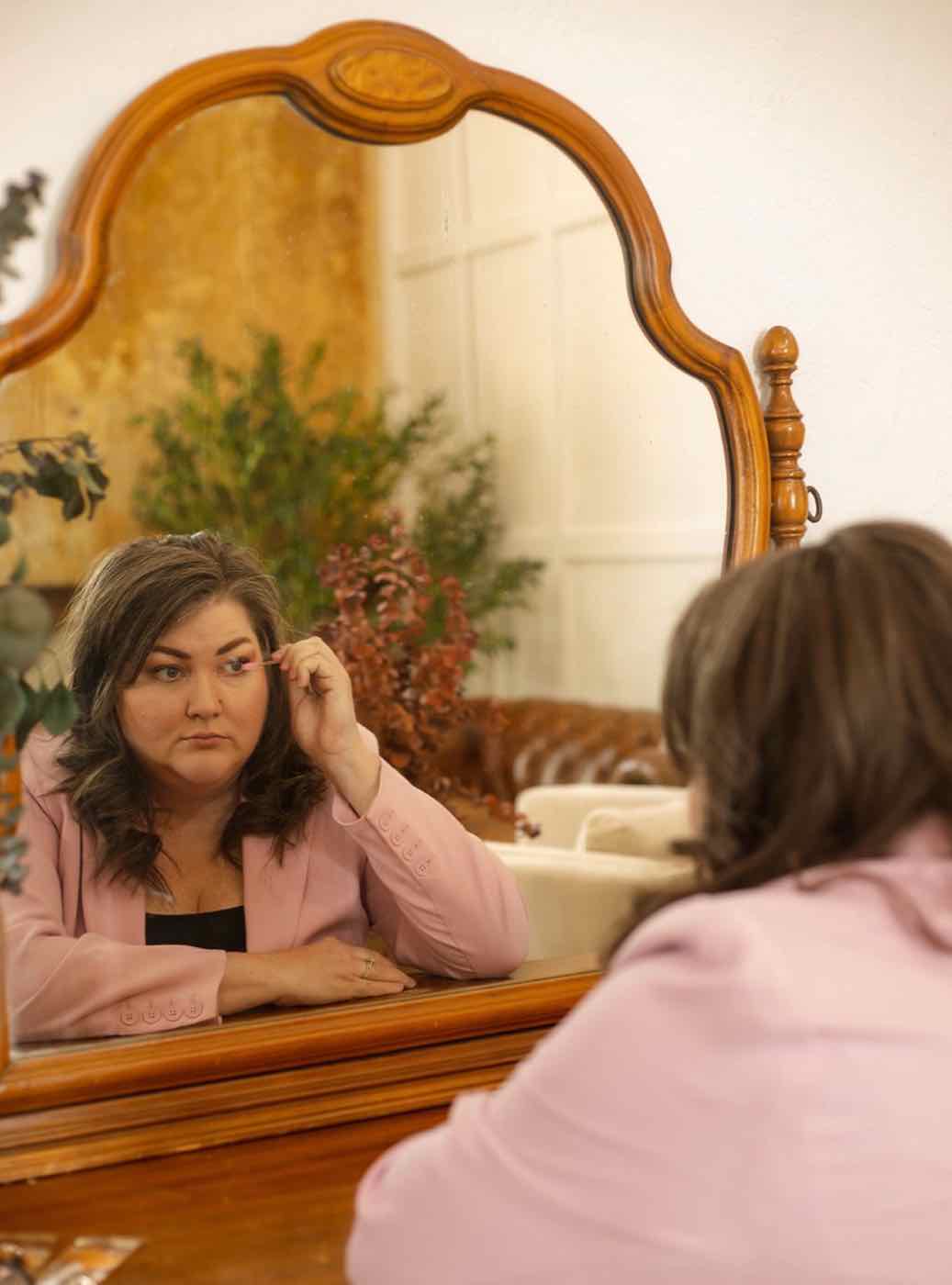 Melinda at the Sonder Skin studio mirror